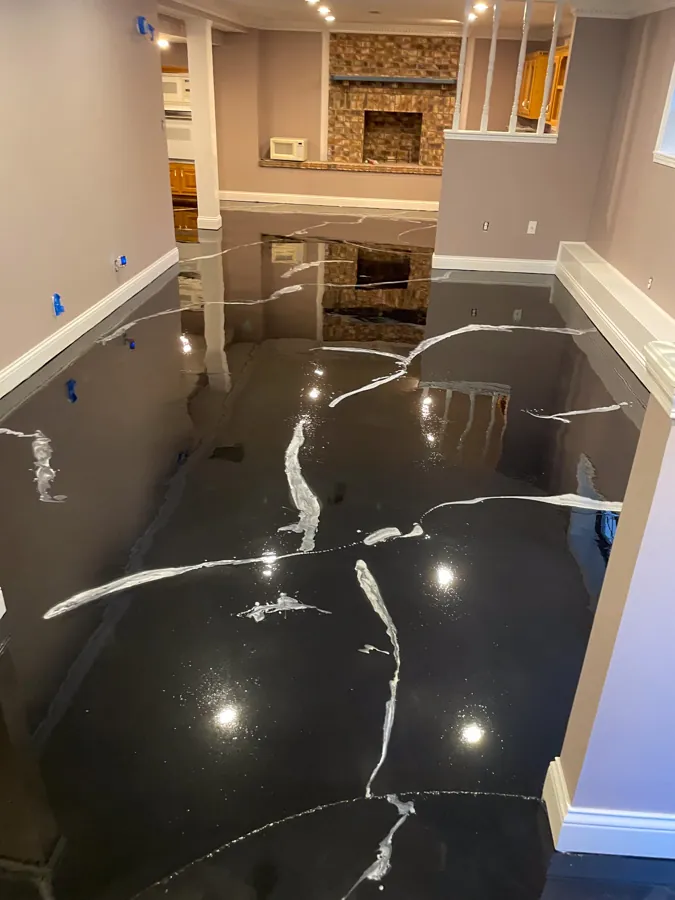 High-gloss black marble-look epoxy basement floor, concrete floor coating serving Antioch, TN