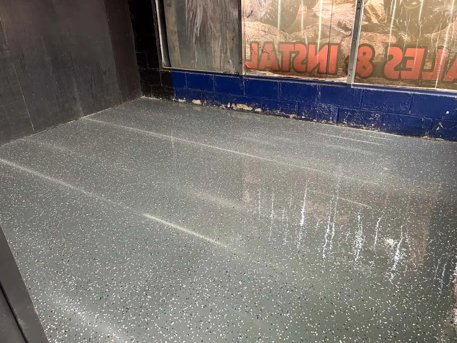 Speckled flake epoxy floor after coating, commercial epoxy flooring serving Nashville, TN