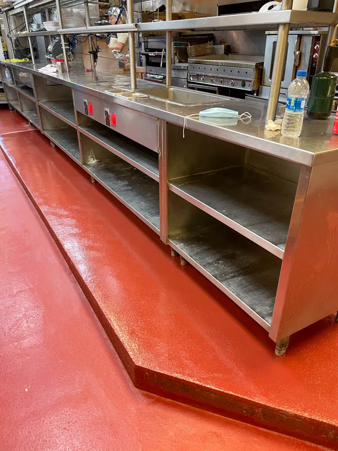 Red epoxy commercial kitchen floor, concrete coating serving Nashville, TN